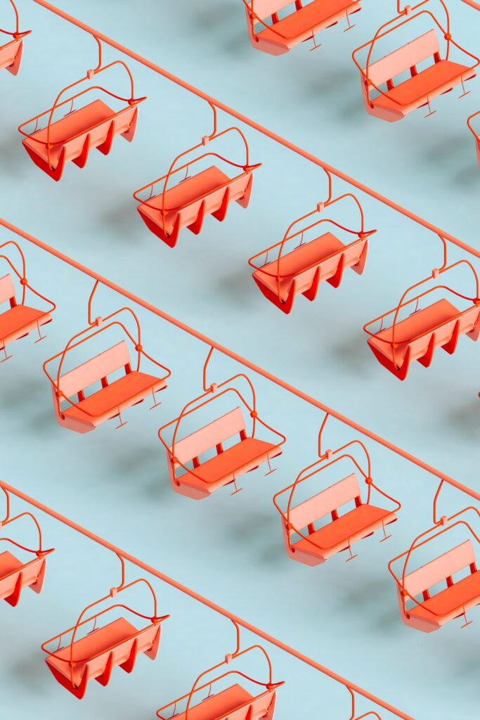Three,Dimensional,Pattern,Of,Red,Ski,Lifts,Floating,Against,Blue