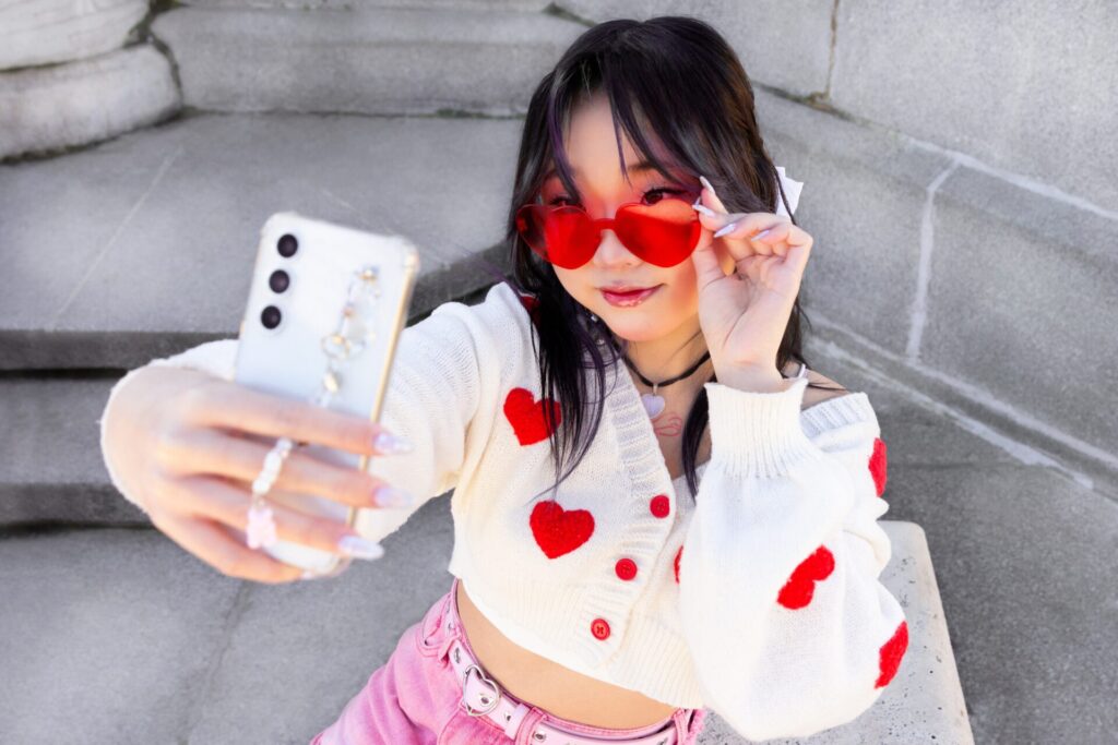 A,Fashionable,Young,Chinese,Girl,Wearing,Heart shaped,Sunglasses,And,A