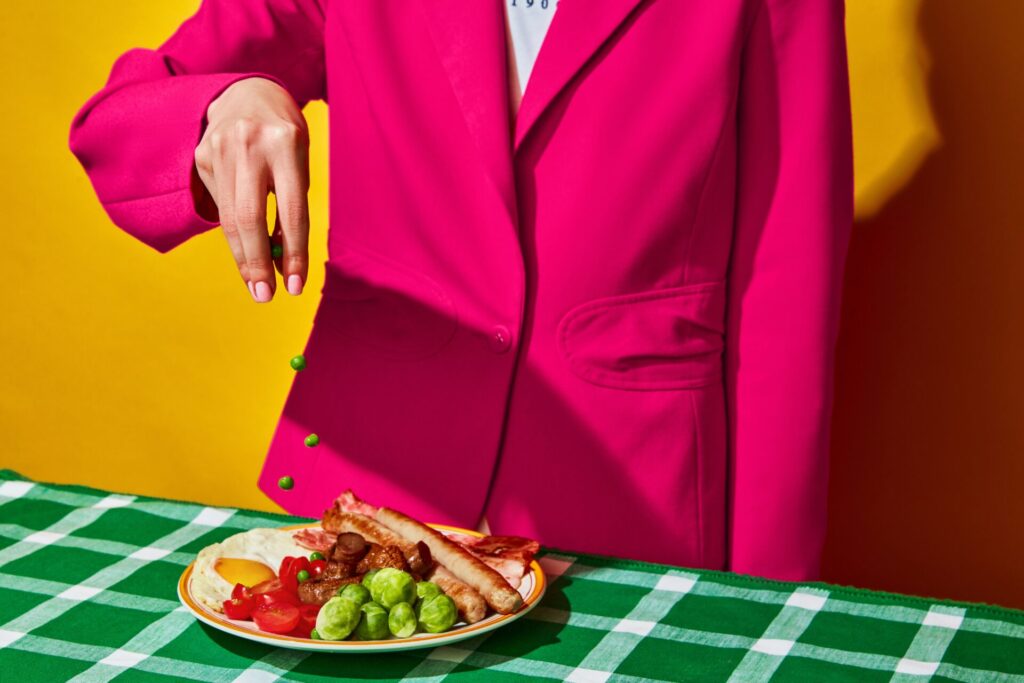 Woman,Cooking,Fried,Eggs,,English,Breakfast,On,Plate,On,Green