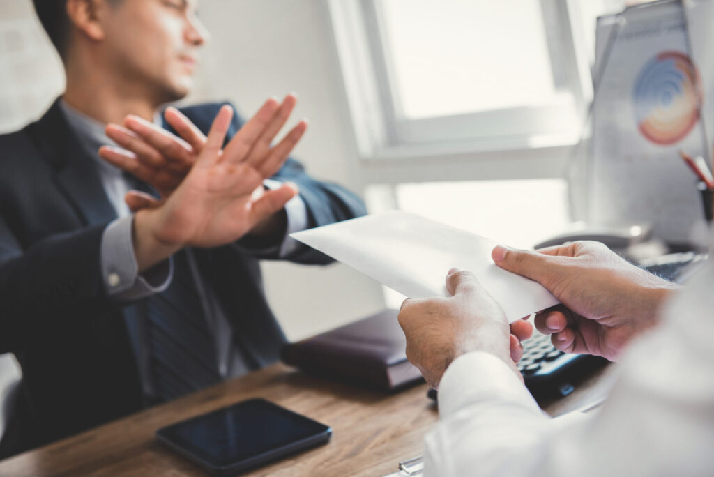 Businessman,Rejecting,Money,In,White,Envelope, ,Anti,Bribery,And