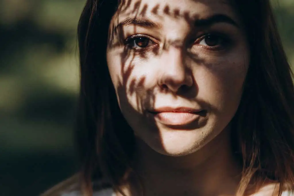 portrait of girl in tree shade