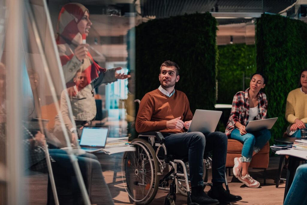 An,Older,Muslim,Businesswoman,Presents,A,Project,To,A,Young