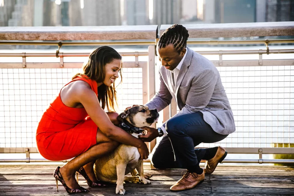 couple takes photo with dog offset 1106396