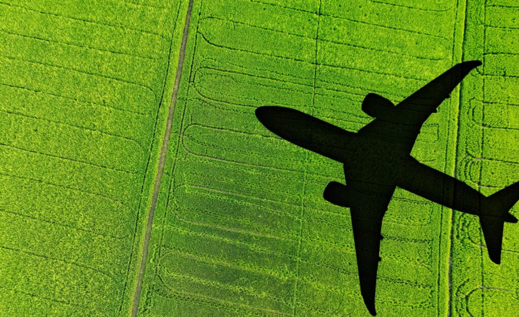 Shadow,Airplane,Flying,Above,Green,Field.,Sustainable,Fuel.,Biofuel,In