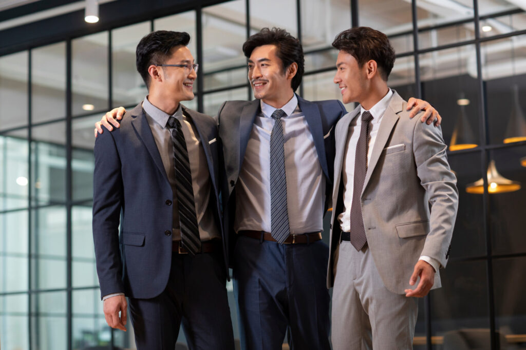 Successful,Chinese,Businessmen,Talking,In,Office