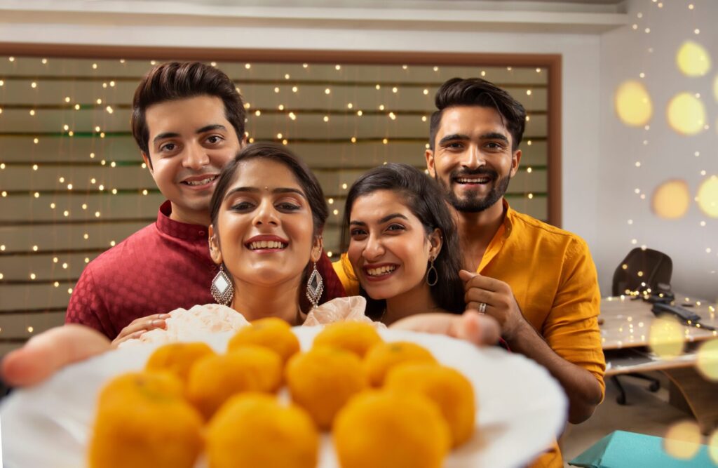 A,Group,Of,Happy,Collegues,Clicking,Selfie,Holding,Sweets,During