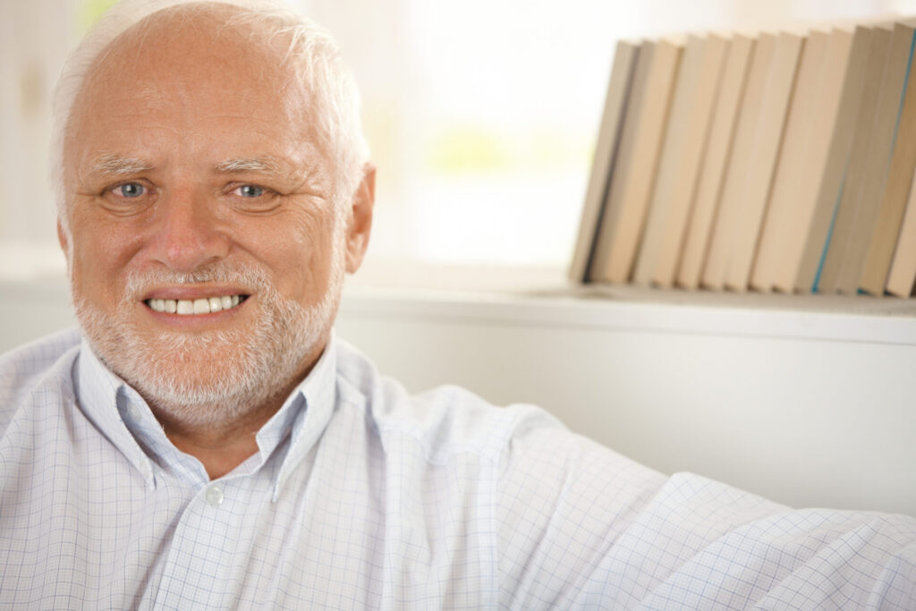 Closeup,Portrait,Of,Happy,Pensioner,Smiling,At,Camera.